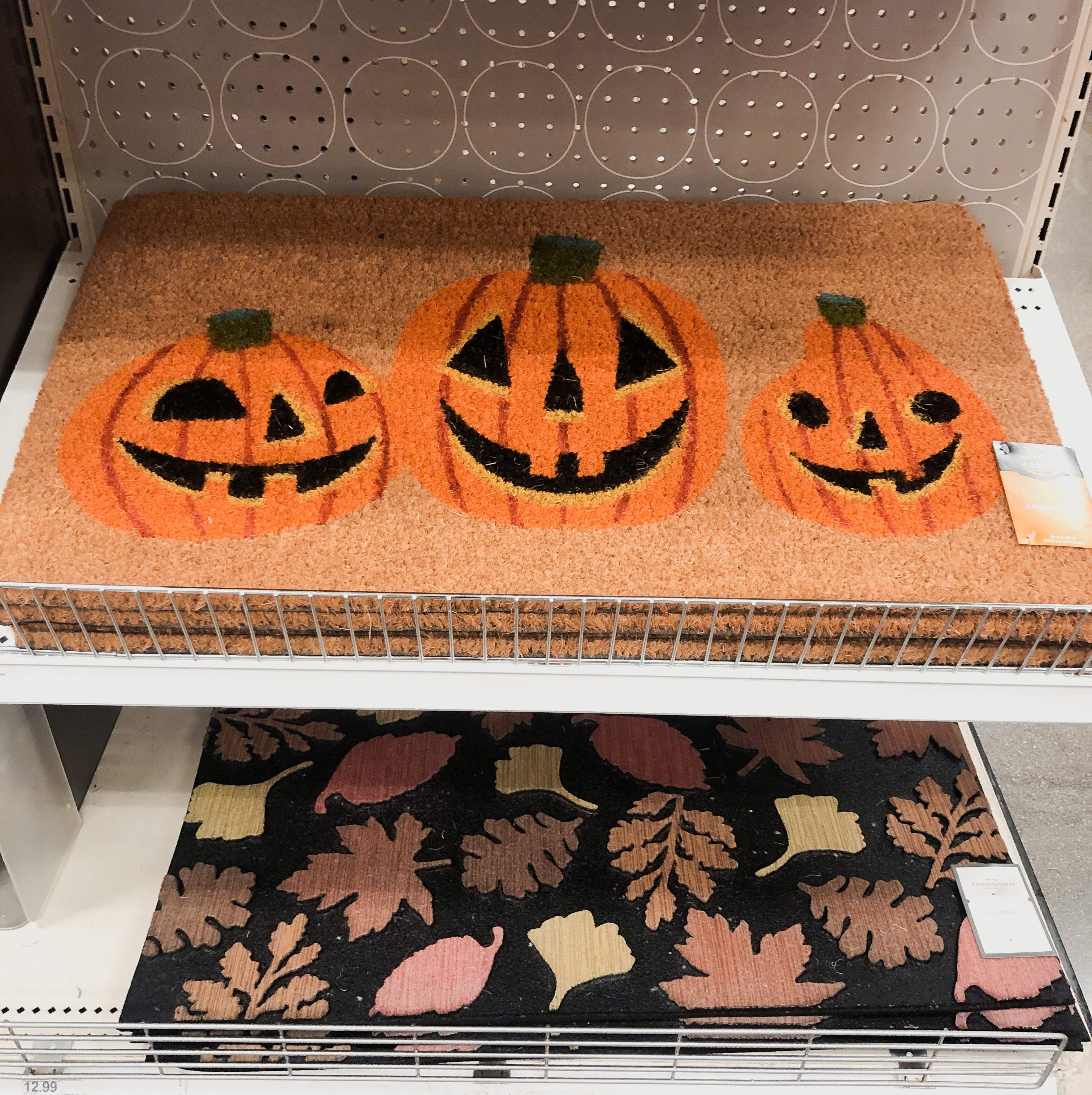 Fall doormats, glass decorative pumpkins.